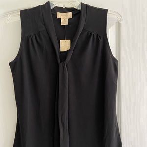 Brand new w tags. Blouse Size Small